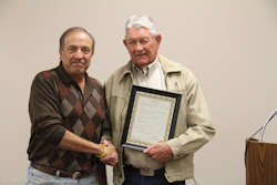 Jerry Seward accepts the proclamation Arbor Day from Mayor LeDoux